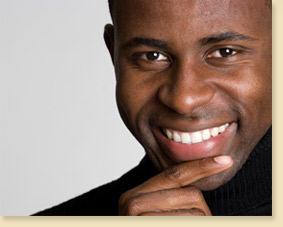 smiling man in black sweater